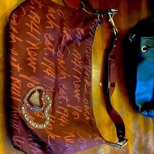 Authentic Coach Burgundy Fabric Shoulder Strap Purse. Heart detail.